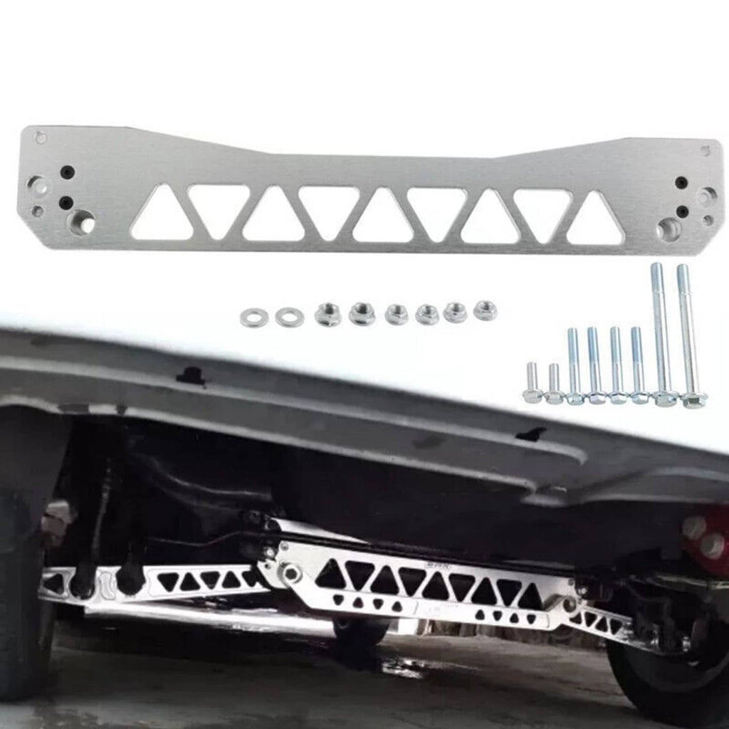 Silver aluminum rear lower control arm and tie bar with triangular cutouts and mounting holes