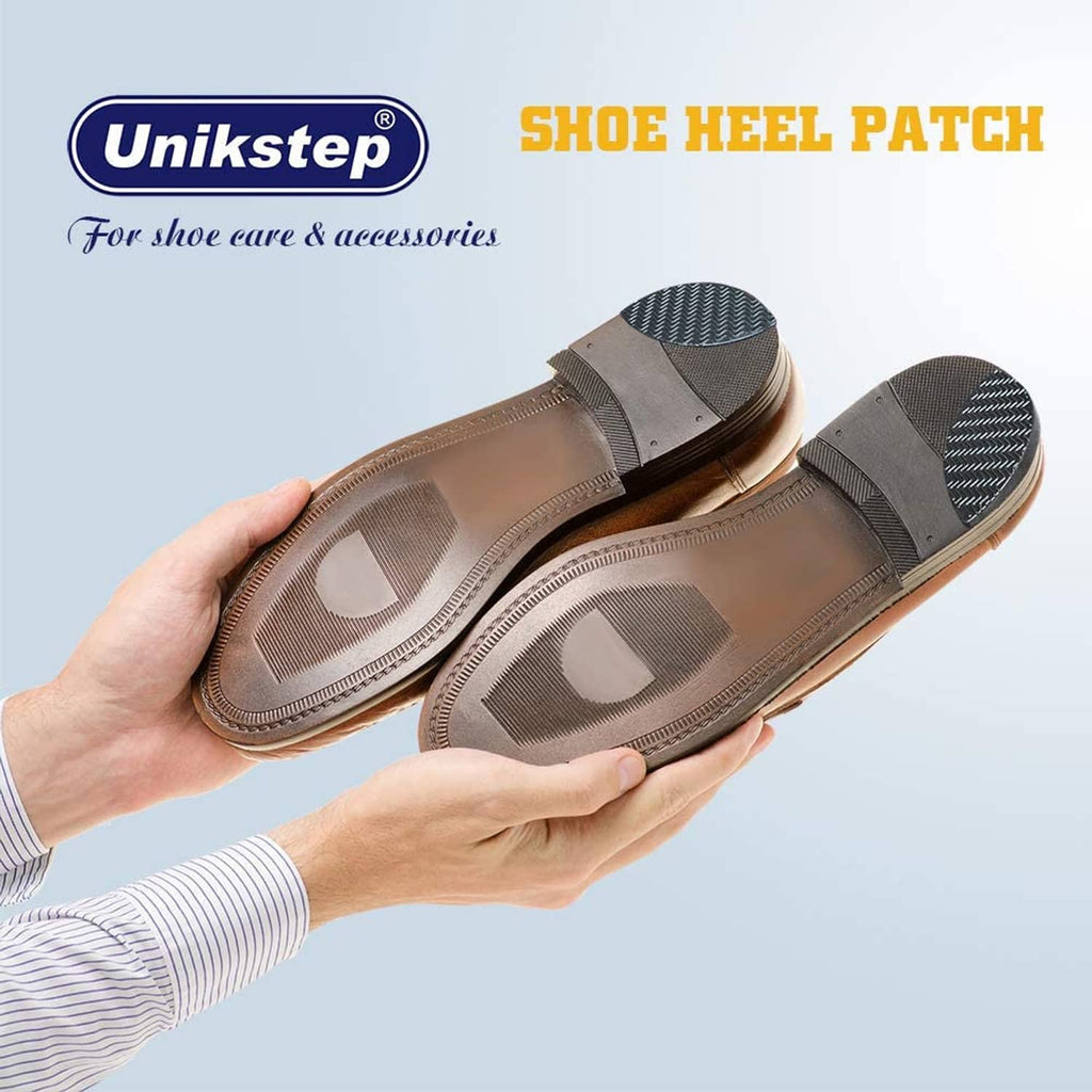 Hands showing installed shoe heel patch on dark shoe outsole area