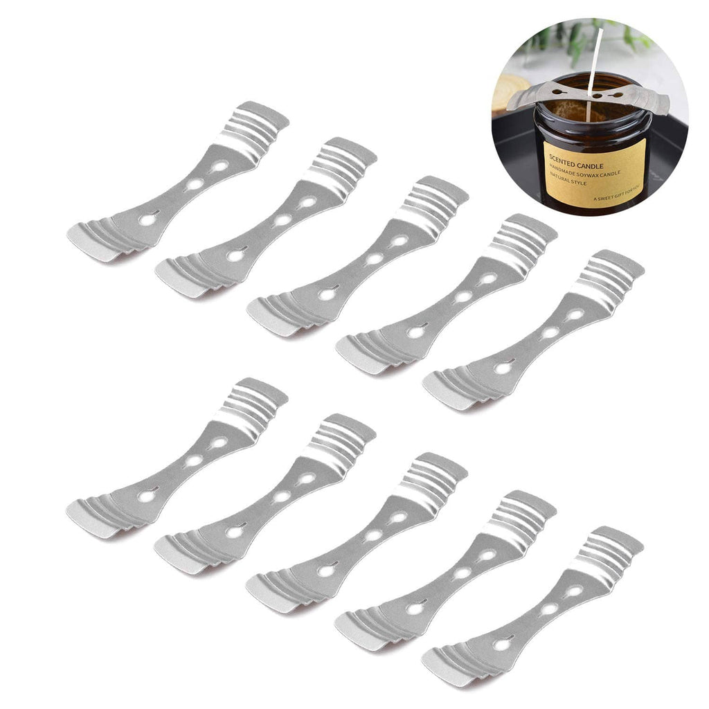 Silver wick centering clips laid out in rows, metal candle accessories for multiple wicks