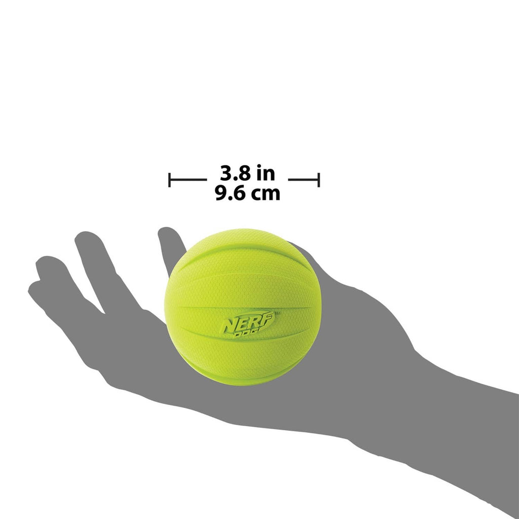 Neon green rubber dog ball, 3.8 in size shown with hand for scale
