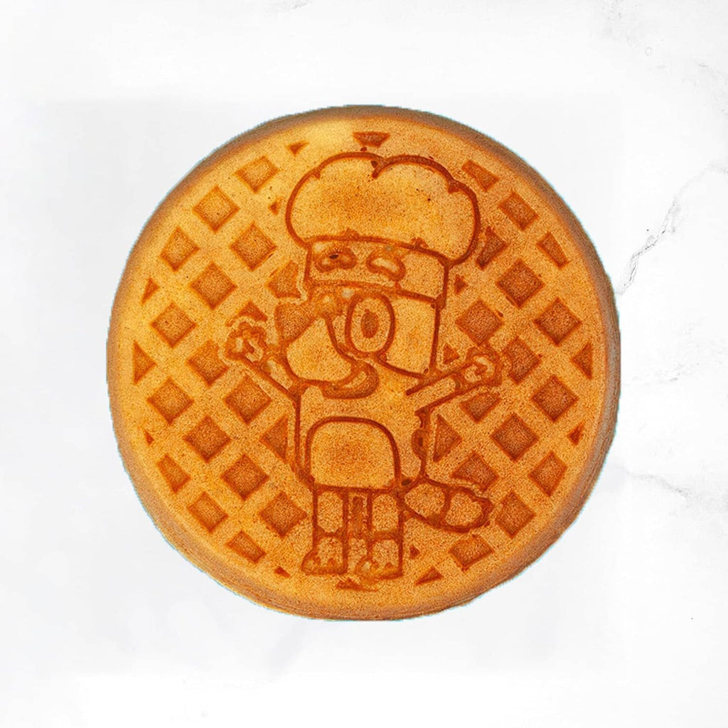 Golden waffle with embossed cartoon chef and grid pattern