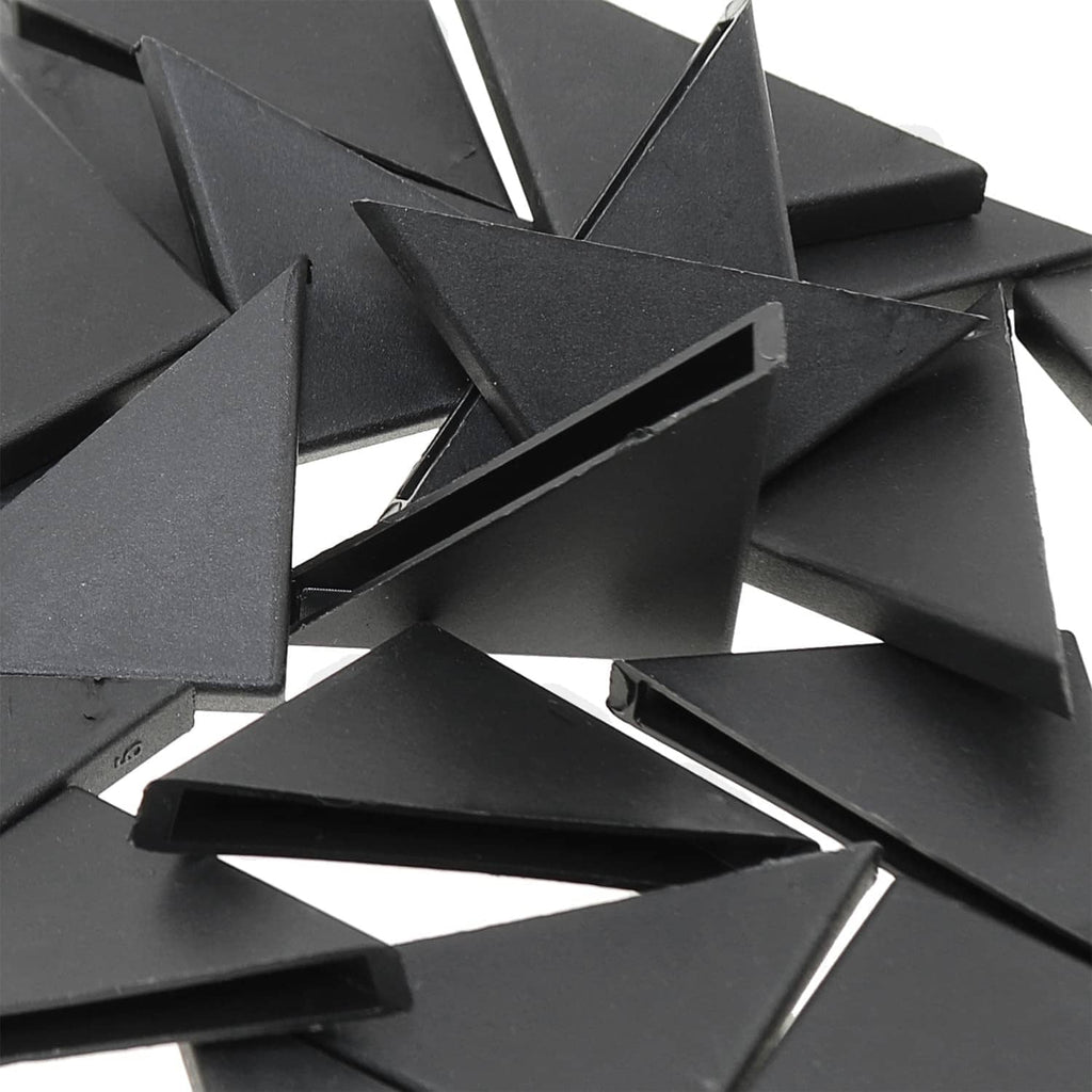 Black triangular corner protectors stacked, protective edge caps