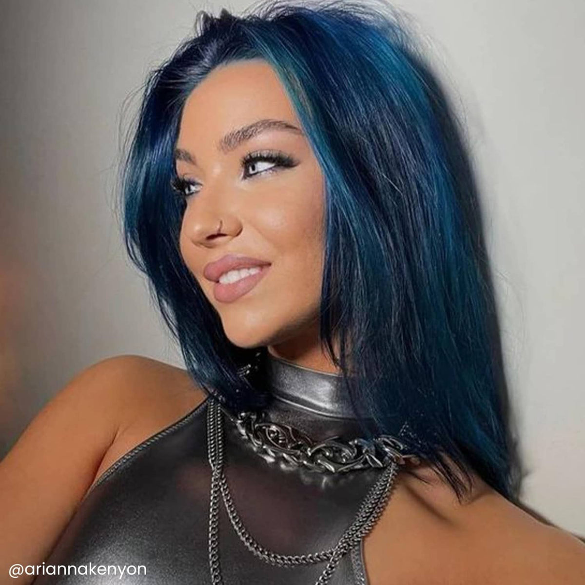 Baby blue hair dye result on long dark hair, side part and bangs