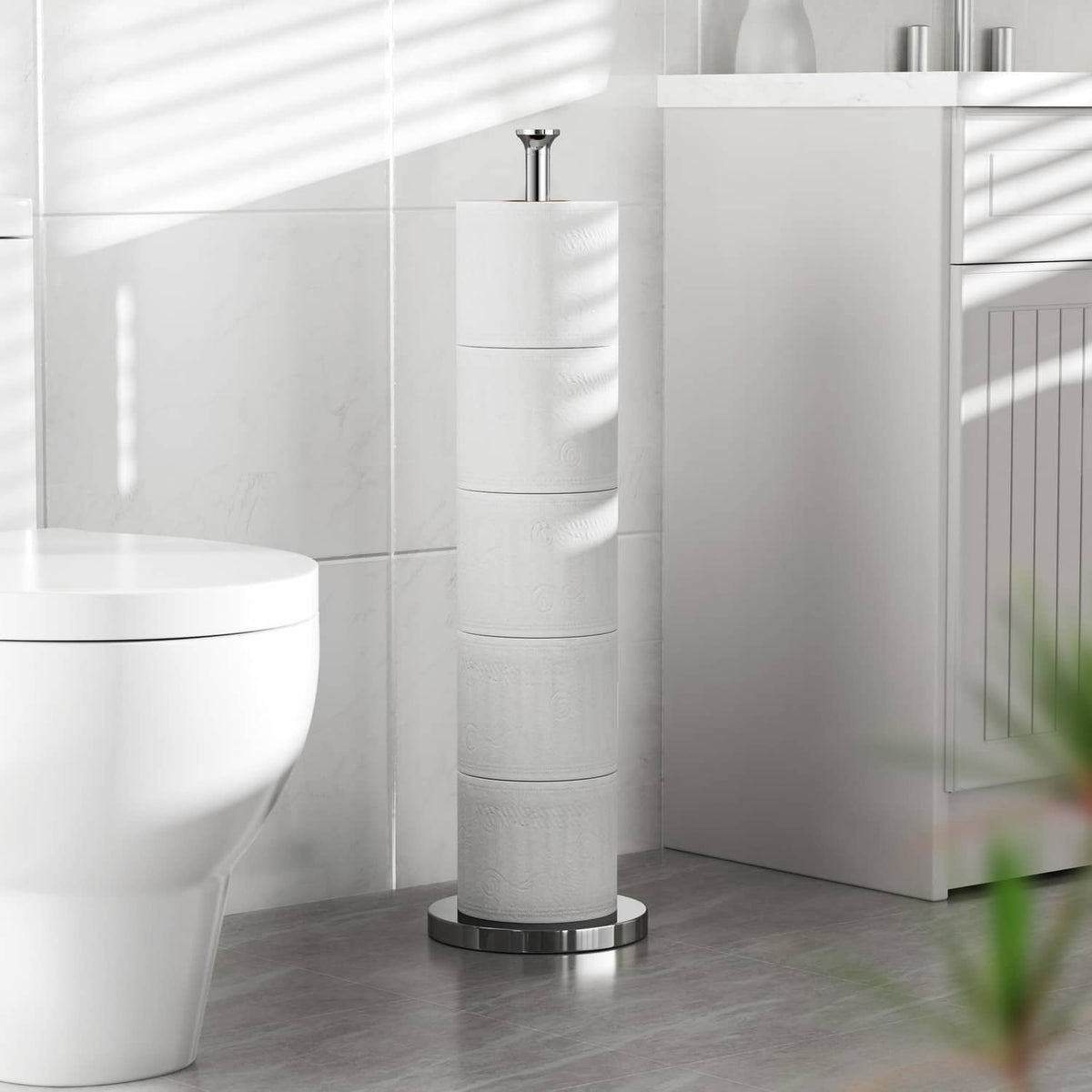 Freestanding chrome toilet paper holder stand with tall roll tower and base