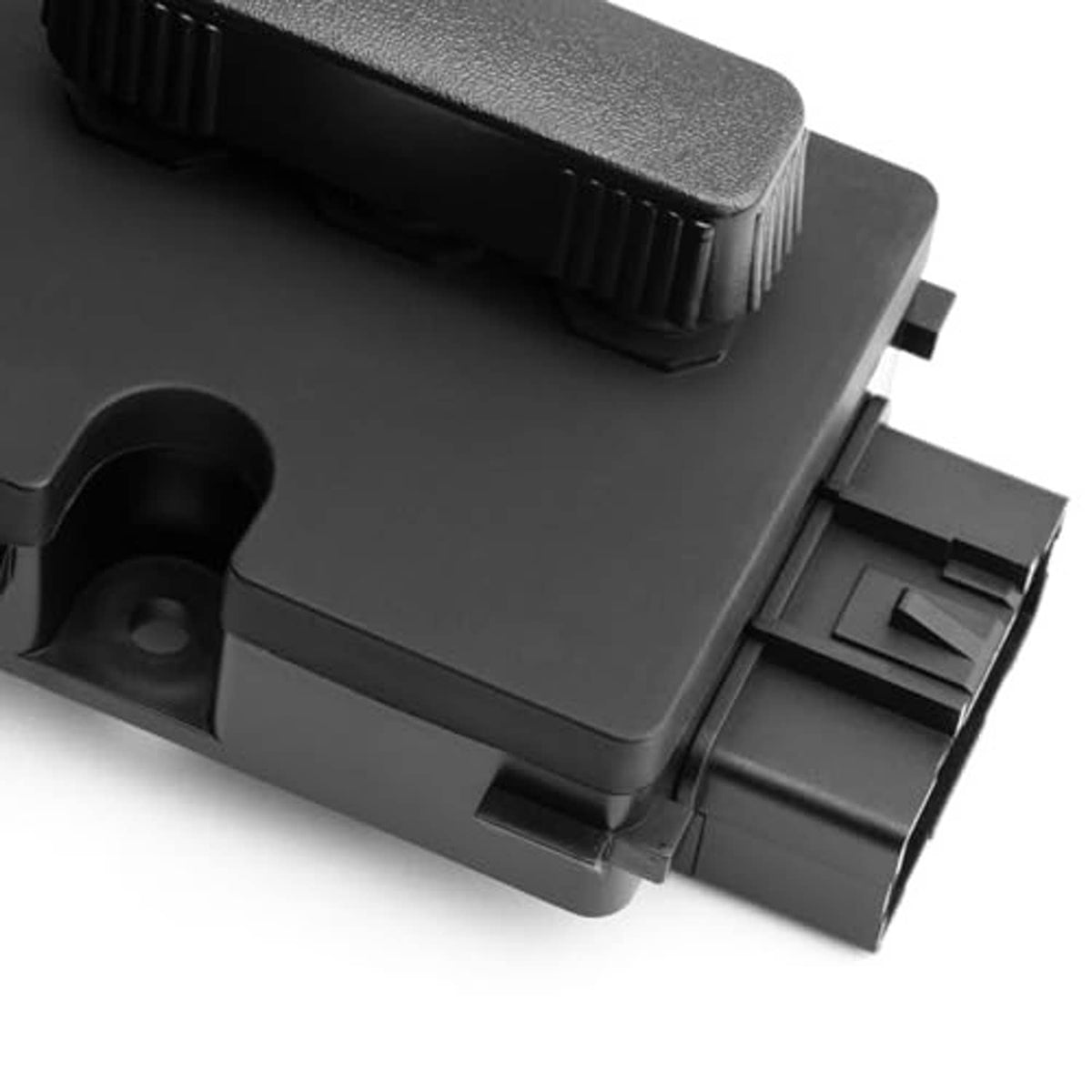 Power seat switch angled view showing textured gray pad and plastic connector