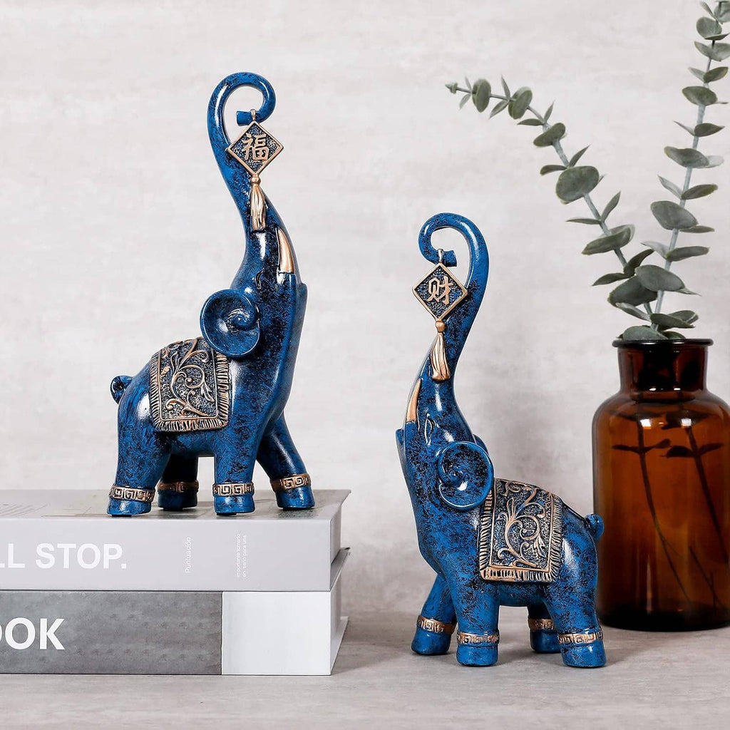 Blue elephant luck statue with hanging diamond charm and gold decorative panel