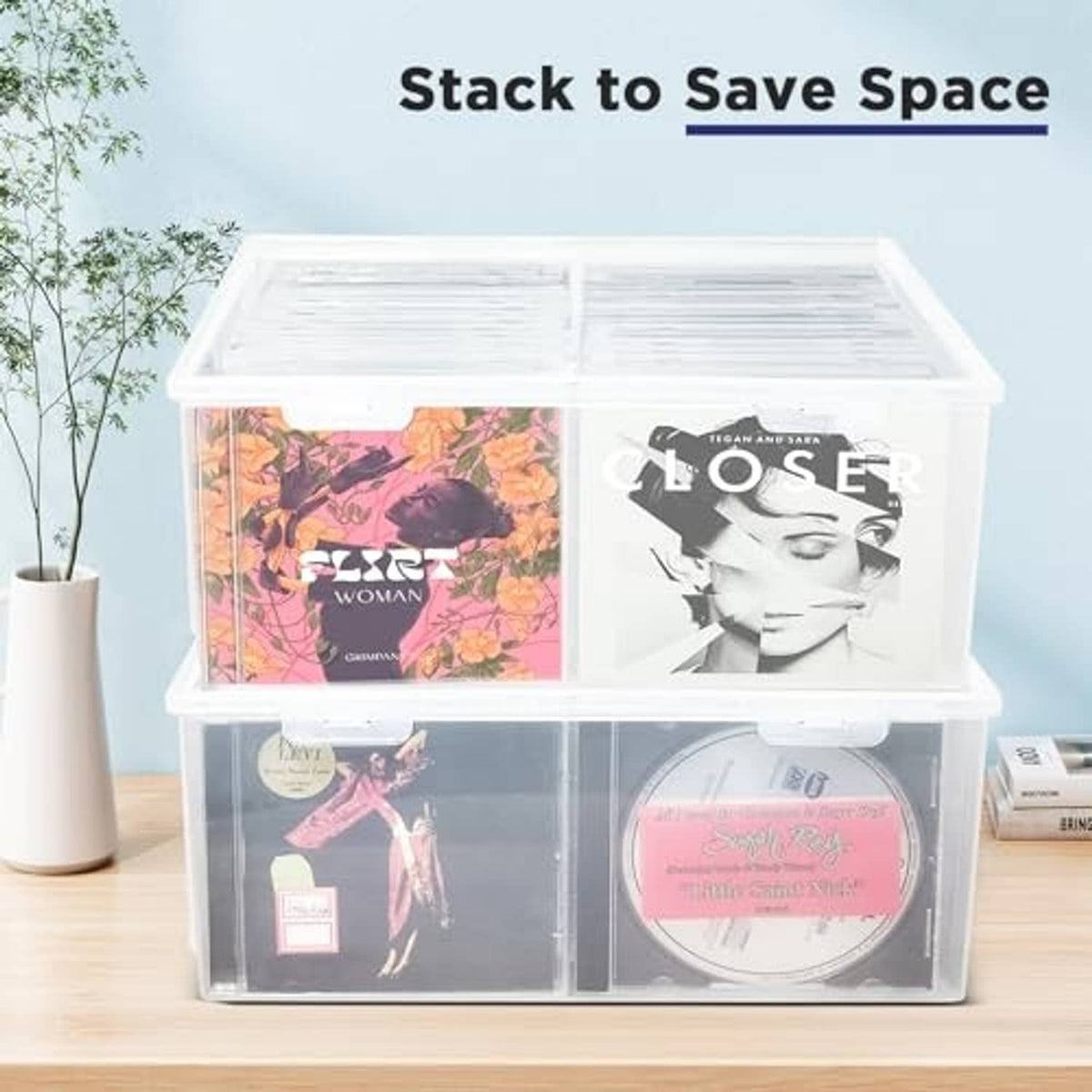 Stacked clear CD storage boxes with visible CD sleeves inside
