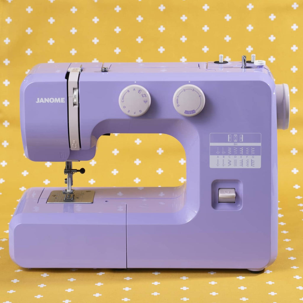 Janome purple sewing machine front view with stitch settings panel