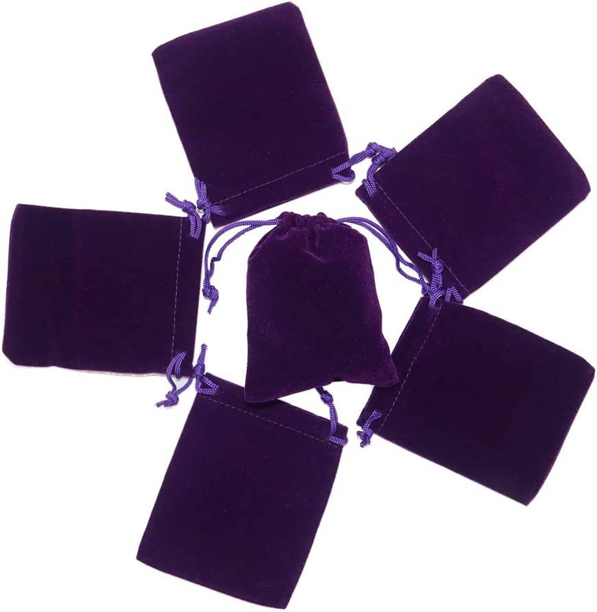 Dark purple velvet drawstring jewelry pouches, five small gift bags shown together