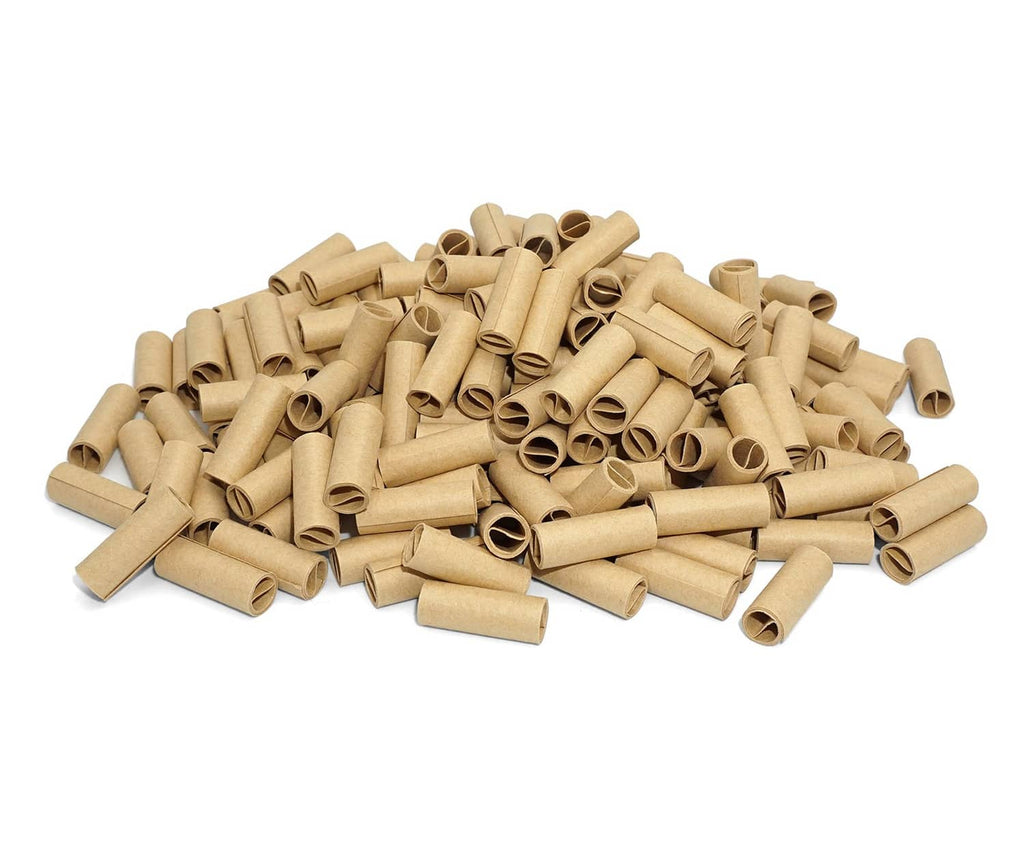 Unbleached brown pre-rolled paper tubes pile with hollow rolled ends