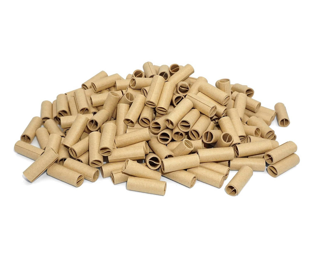 Unbleached brown pre-rolled paper tubes pile with hollow rolled ends