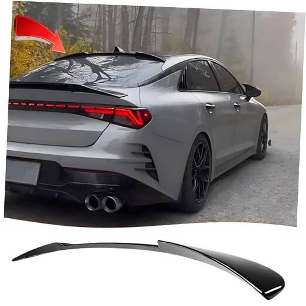 Black roof spoiler wing for rear window, mounted on a silver sedan.