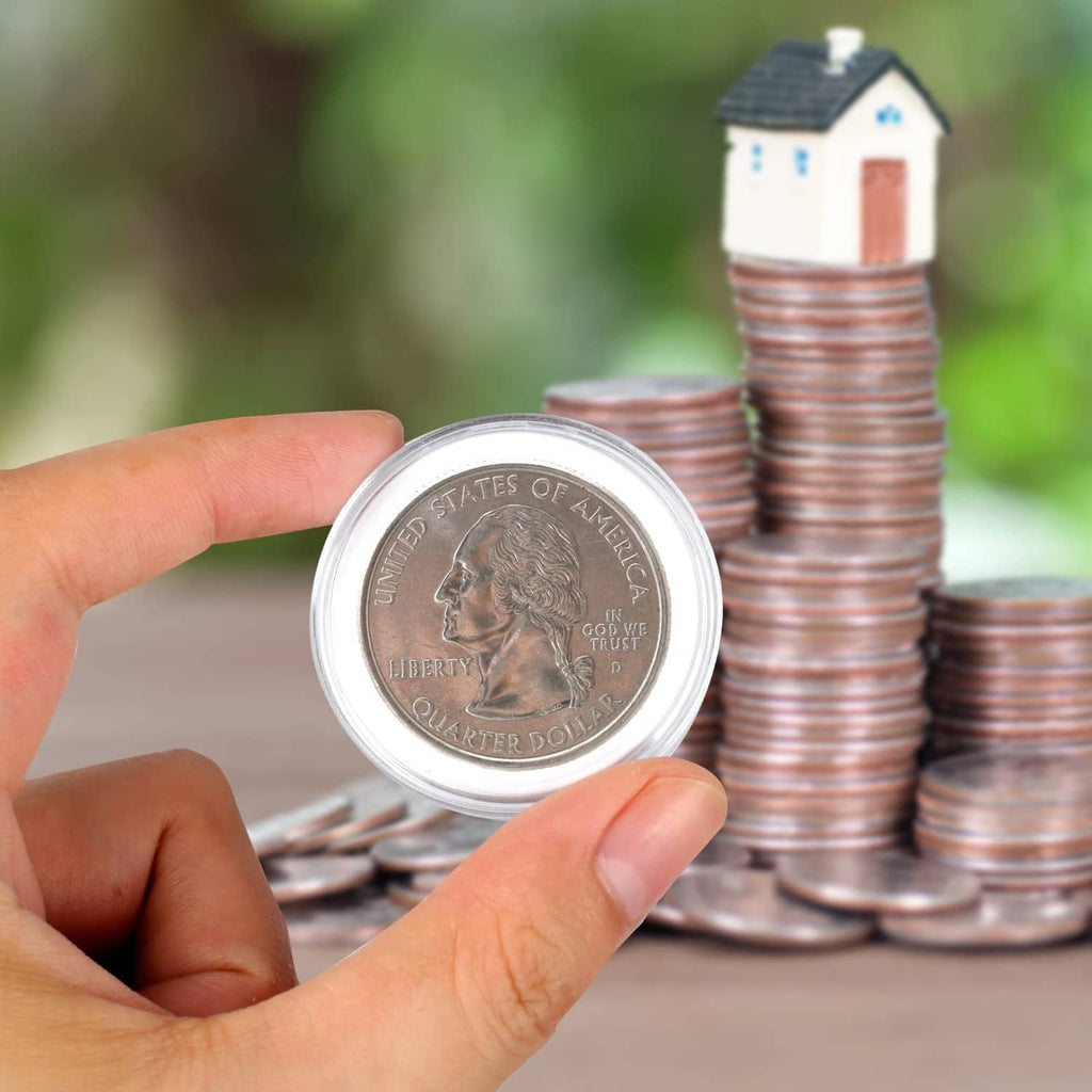 Clear coin capsule holding a quarter coin, hands and stacked capsules in view