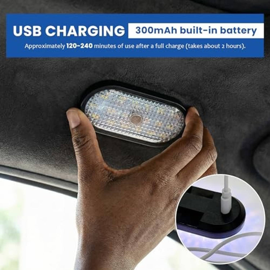 Oval car LED dome light held in hands, black housing with clear multi-LED face
