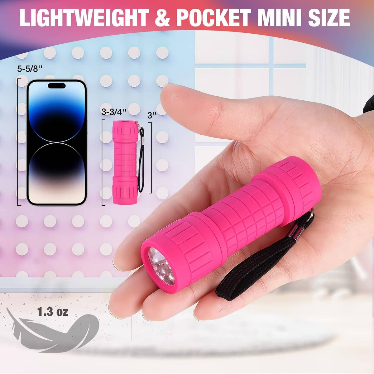 Pink pocket mini UV blacklight flashlight held in hand with round LED lens