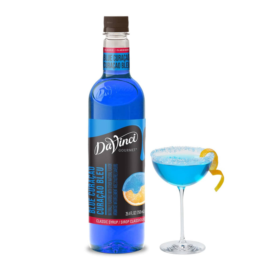 DaVinci Gourmet Blue Curacao syrup bottle with blue cocktail in a stem glass
