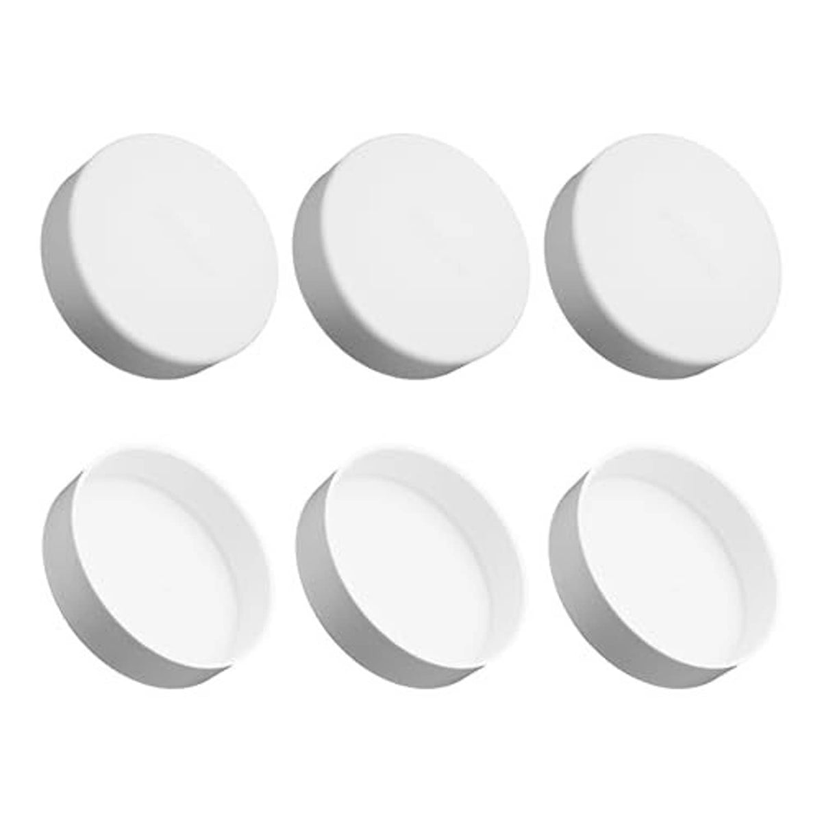 Set of six white PVC 2-inch pipe end cap plugs, angled view