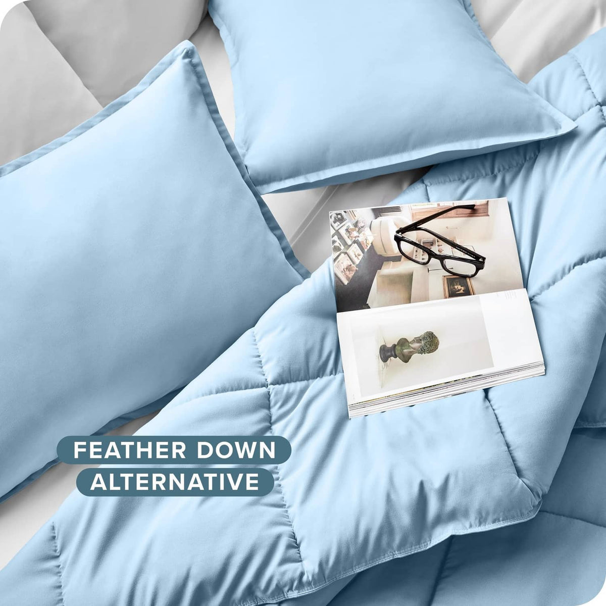 Light blue pillow sham and comforter with stitched edge detail, down-alternative look