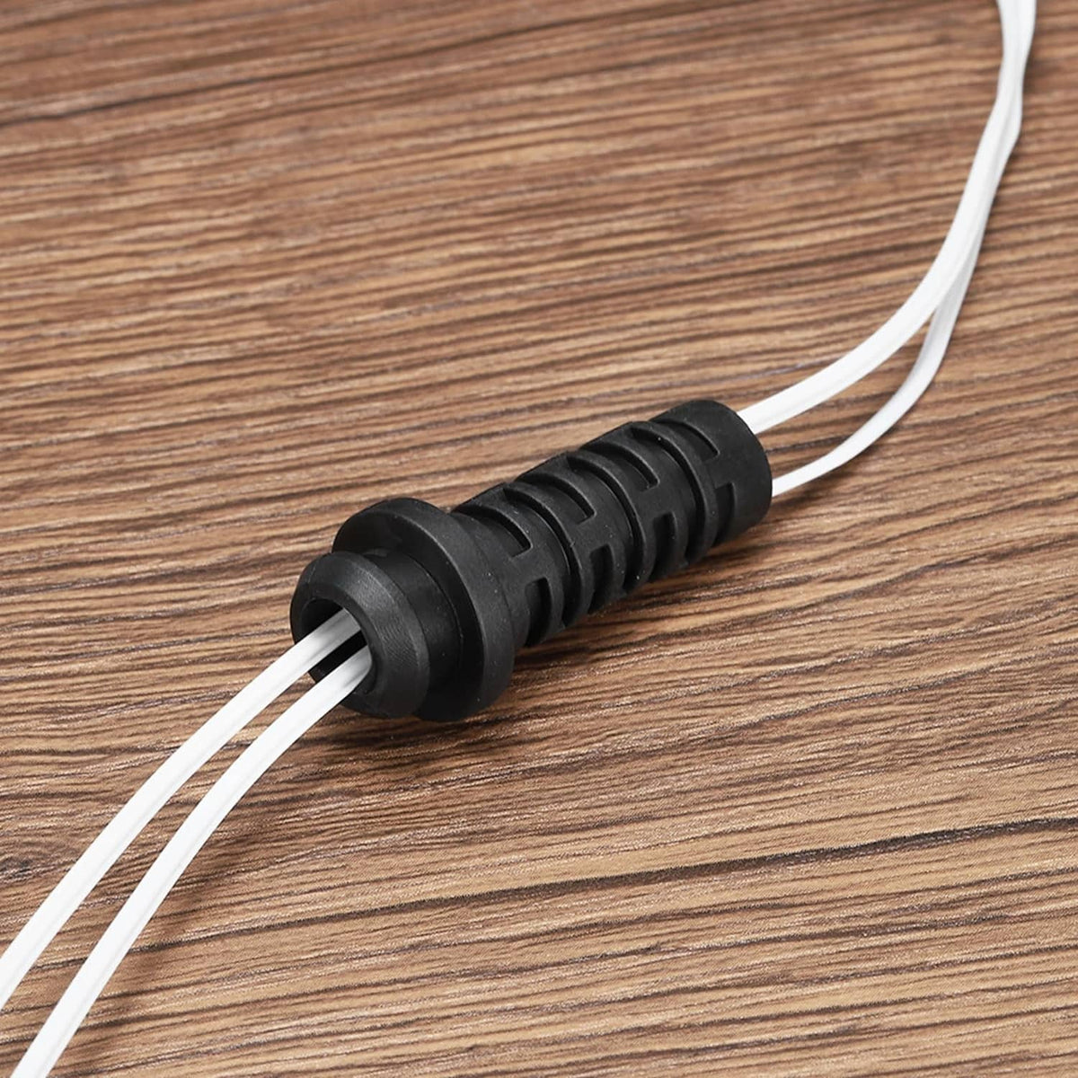 Black 3mm strain relief cable bushing sleeve connector gripping two wires