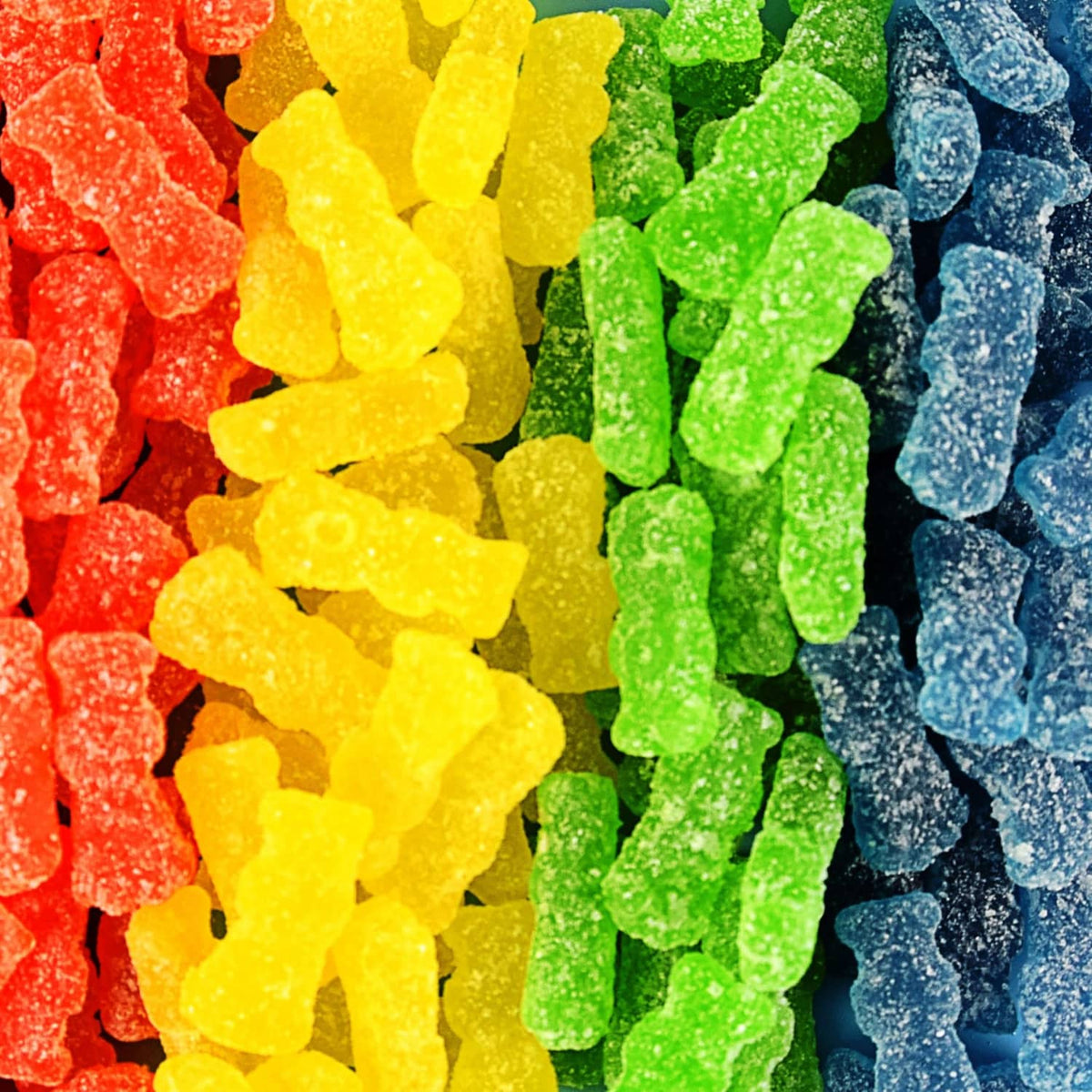 Assorted multicolor sour gummy candy pieces, sugar-coated and chewy-looking