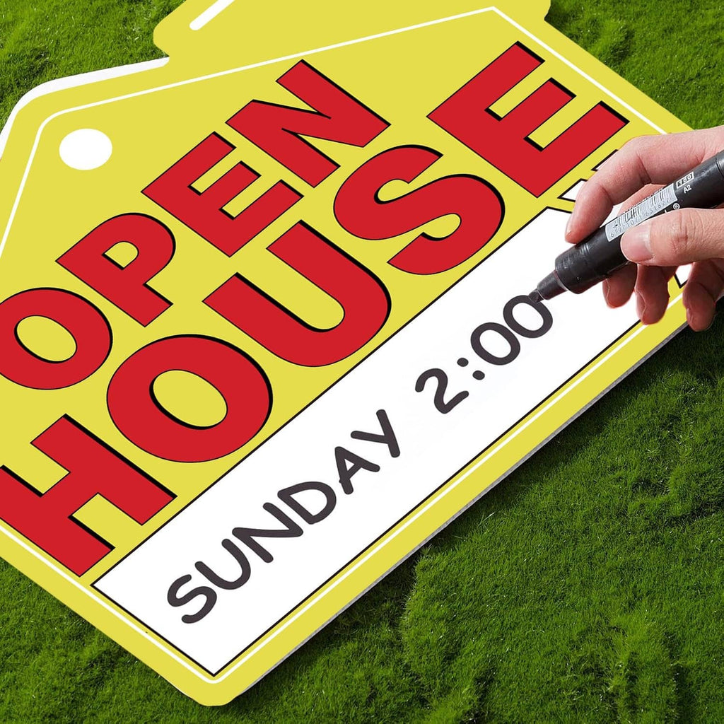 Yellow open house sign close-up showing red letters with handwritten “Sunday”