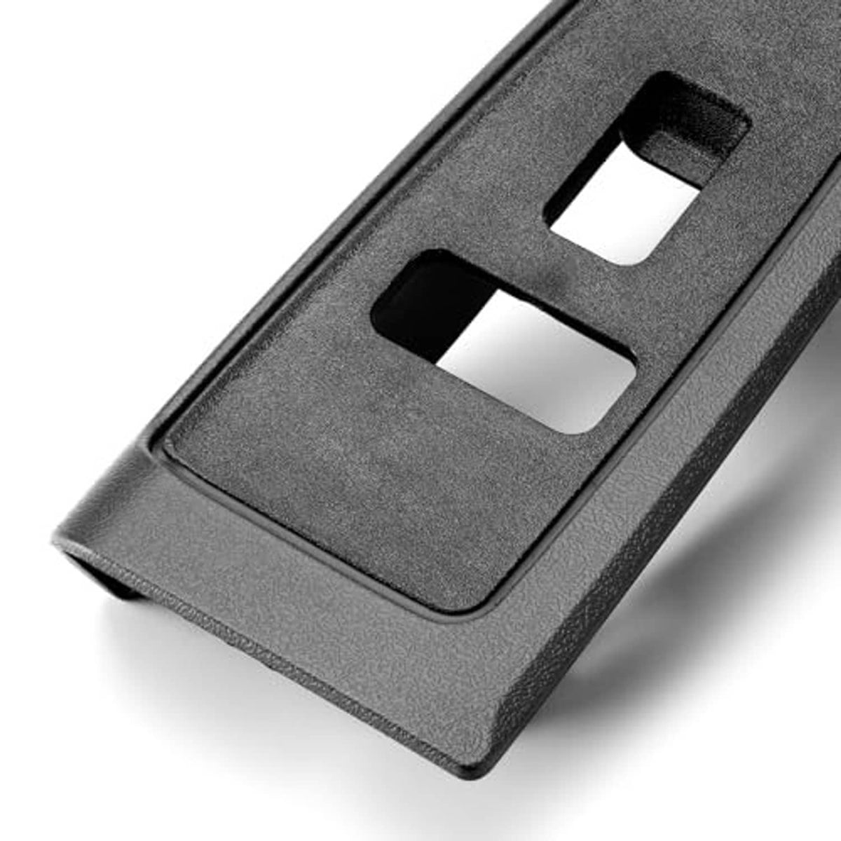 Window switch bezel cover close-up, textured dark plastic with two rectangular openings