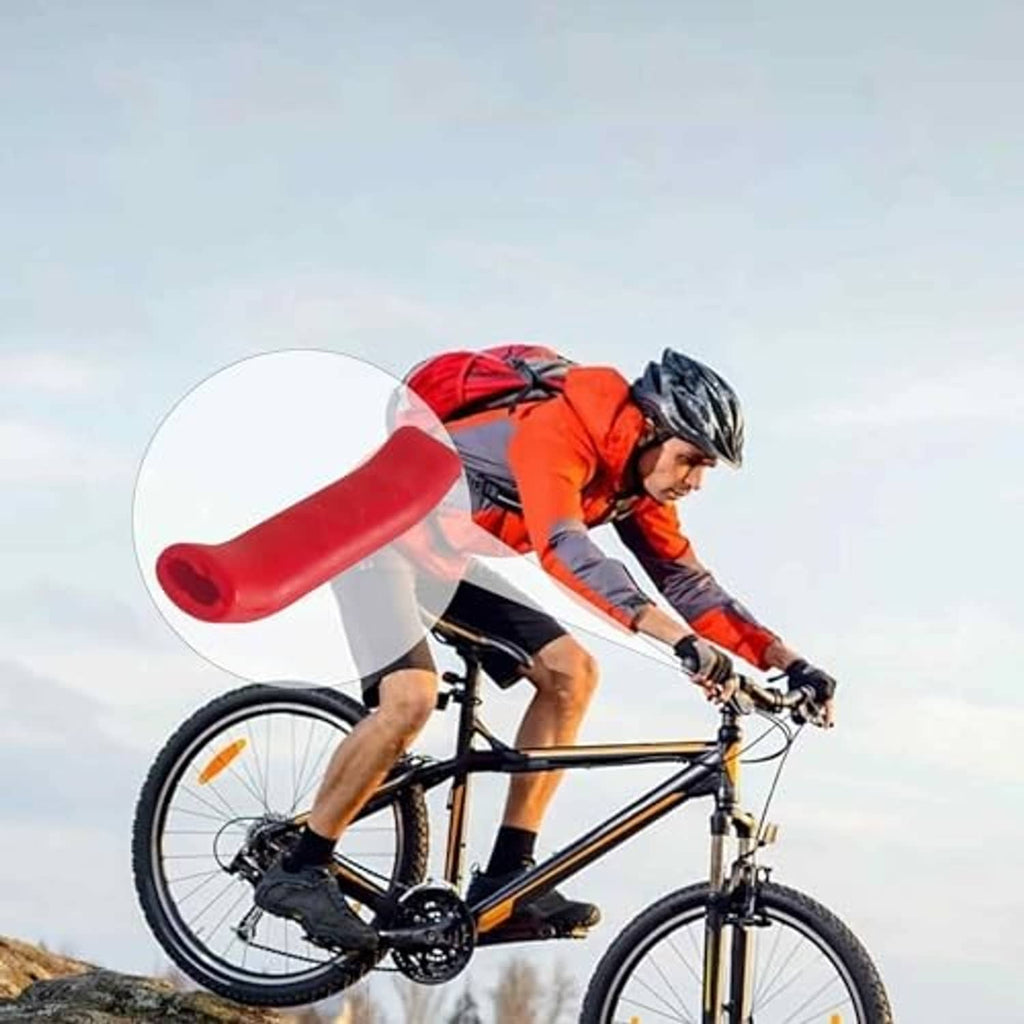Red silicone brake lever grip cover on a bicycle near the handlebar lever