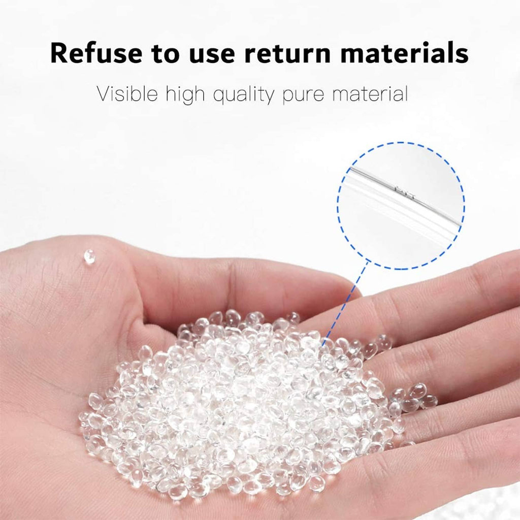 Clear polyurethane tube material pellets in hand, small transparent beads