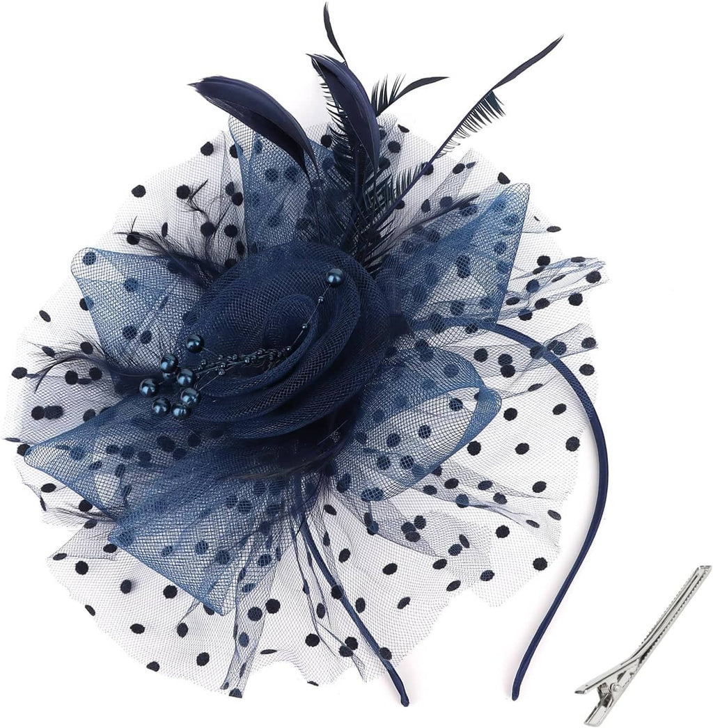 Navy fascinator hat with polka-dot tulle veil, flower and feather accents, thin headband