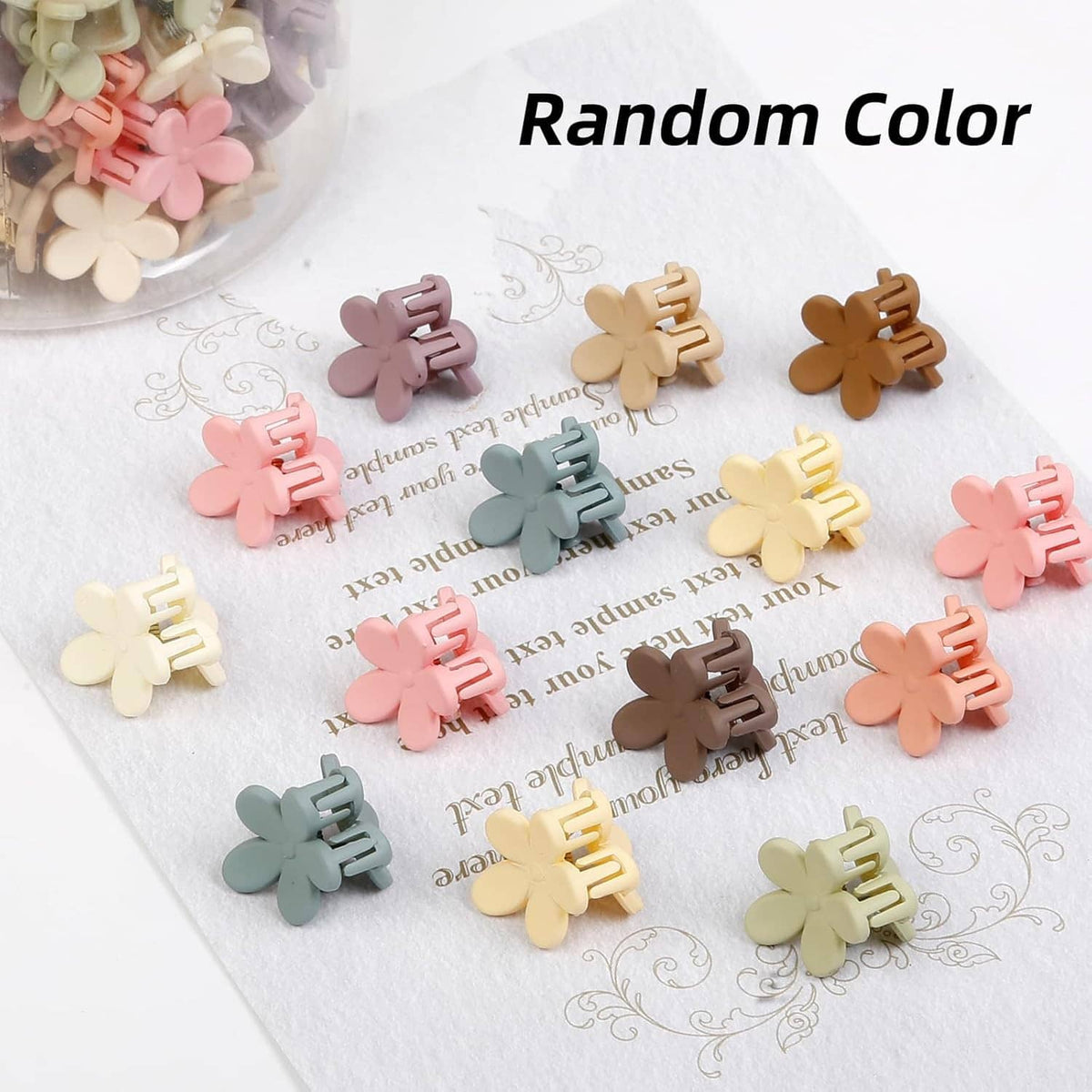 Mini flower claw hair clips scattered in random colors, small pastel and tan clips