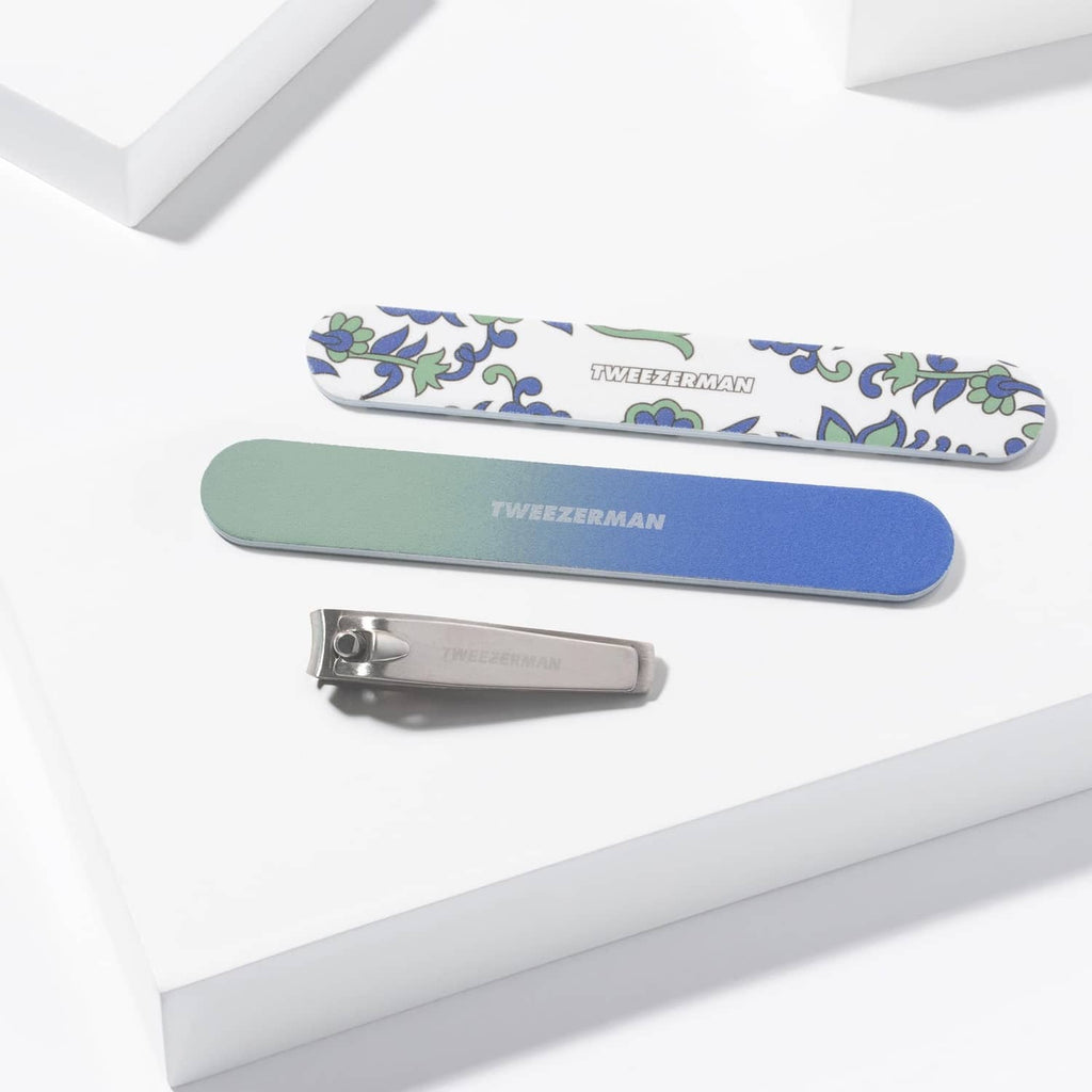 Manicure set with two nail files and a silver nail clipper, paisley accents