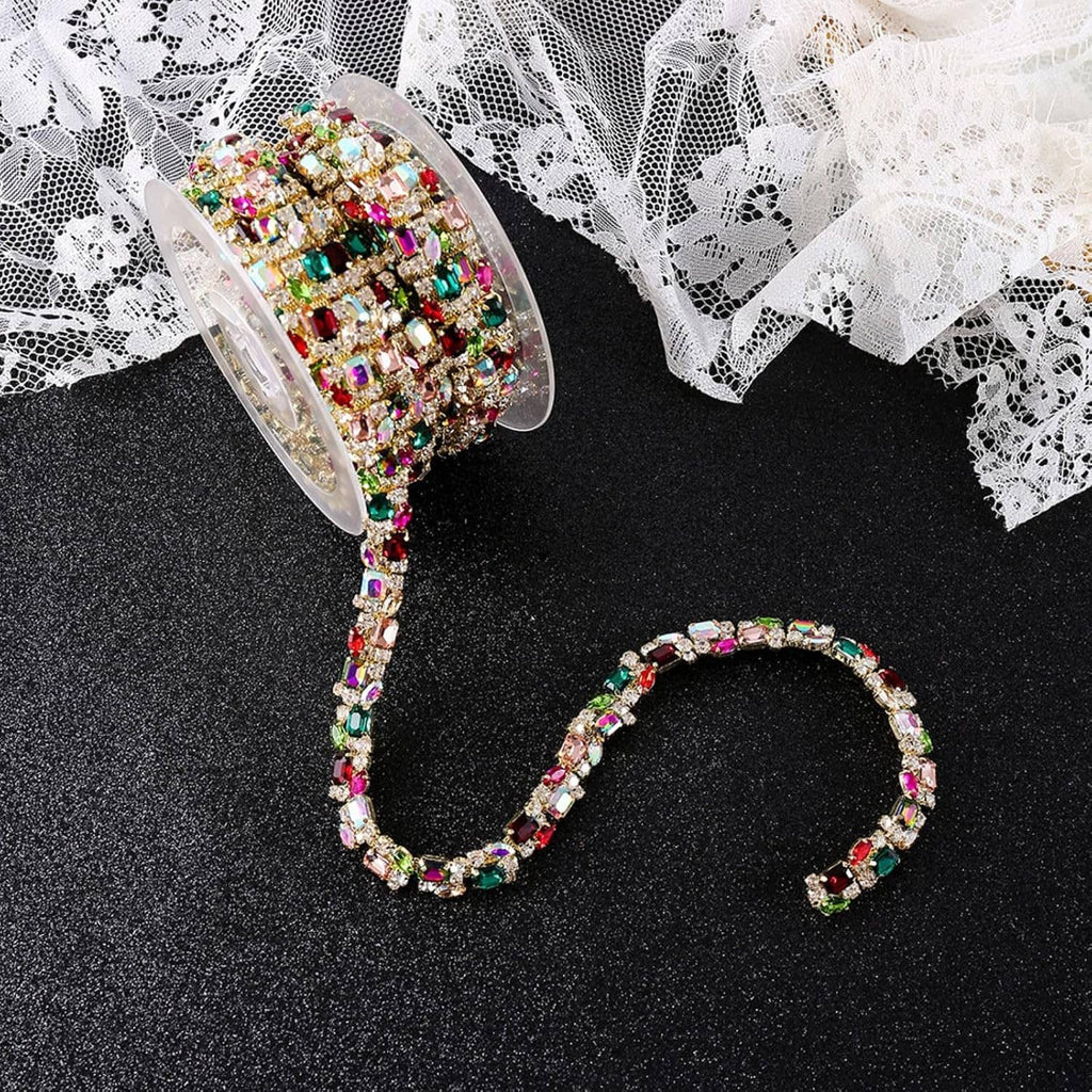 Multicolor rhinestone trim chain on a spool, with looped length and lace trim