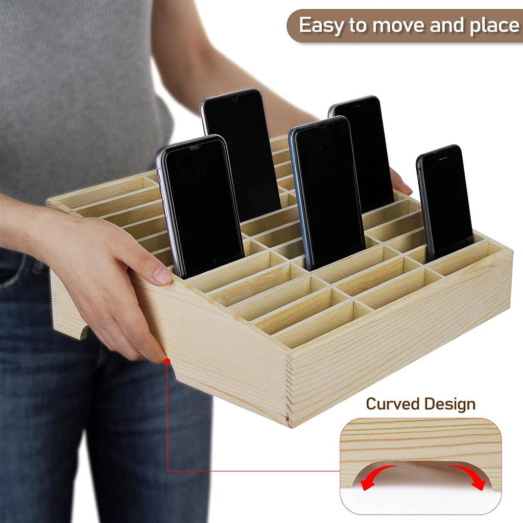 Wooden 36-grid cell phone holder tray with curved base while hand adjusts phones