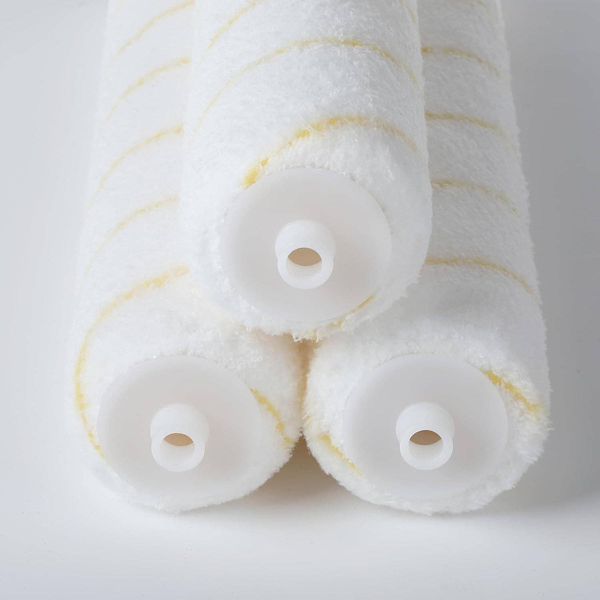 3-pack microfiber paint roller covers, white with yellow stripe lines, roll ends exposed