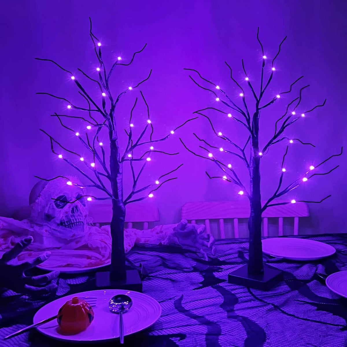 Pair of lit birch-style tabletop trees with glowing purple LED bulbs on thin branches
