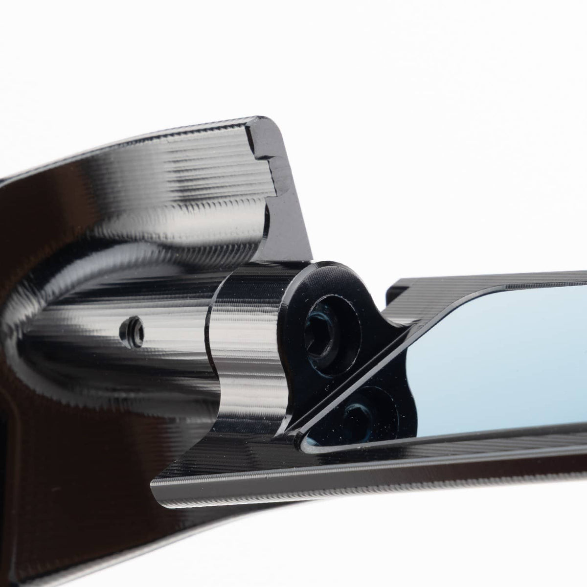 Motorcycle mirror mounting bracket close-up with blue lens and adjustment hardware