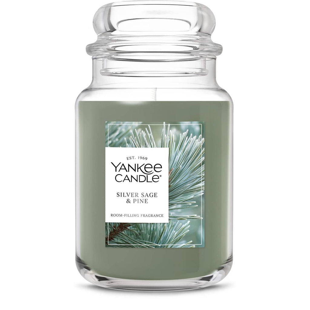 Large scented glass jar candle with green wax and Pine & Sage label