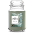 Large scented glass jar candle with green wax and Pine & Sage label