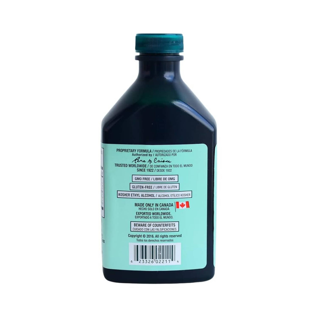 Essiac herbal extract bottle, nutrition and warning labels on dark bottle with teal base
