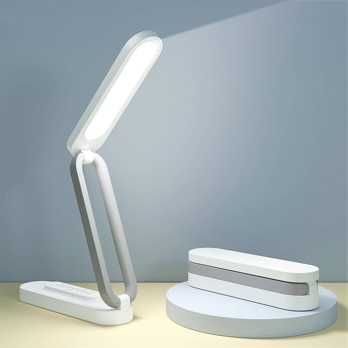 Foldable white LED desk lamp with glowing light bar and arched stand on base