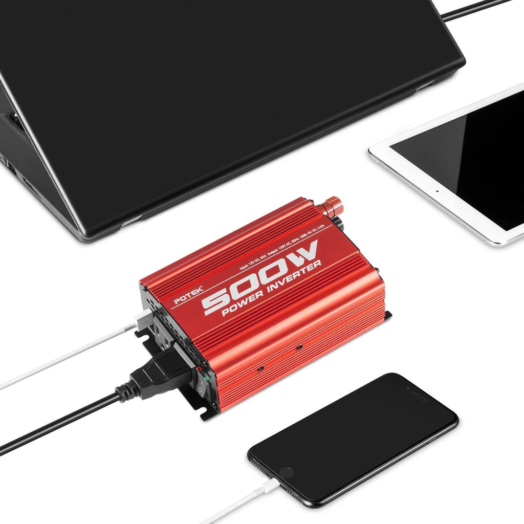 Red Potek 500W inverter with AC outlets and cables powering a laptop and smartphone