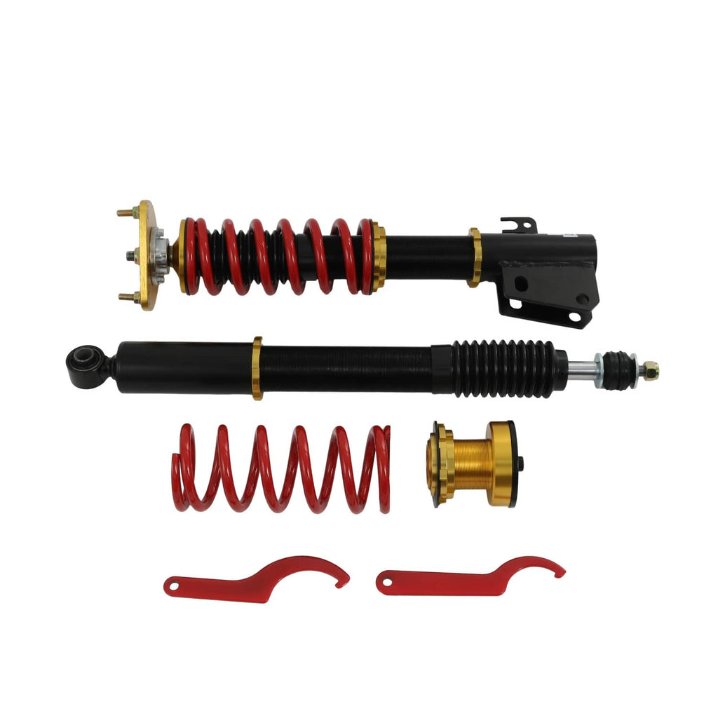Coilover strut set showing red springs, black shocks, and gold spring seats