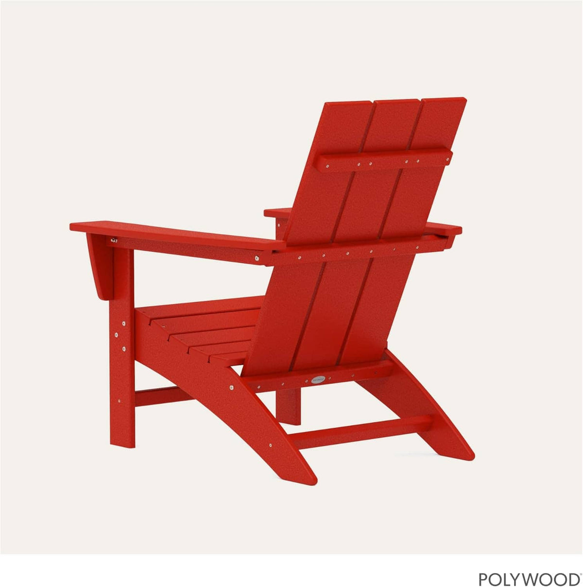 Red Adirondack rocking chair with slatted back and extended footrest
