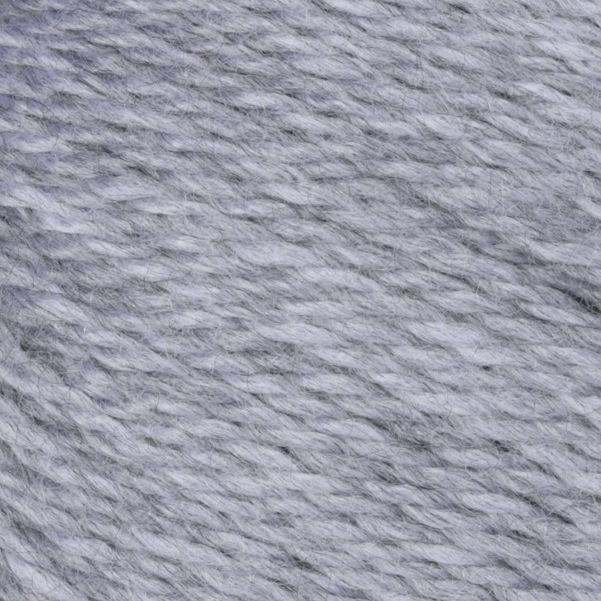 Light gray acrylic yarn close-up showing twisted strand texture