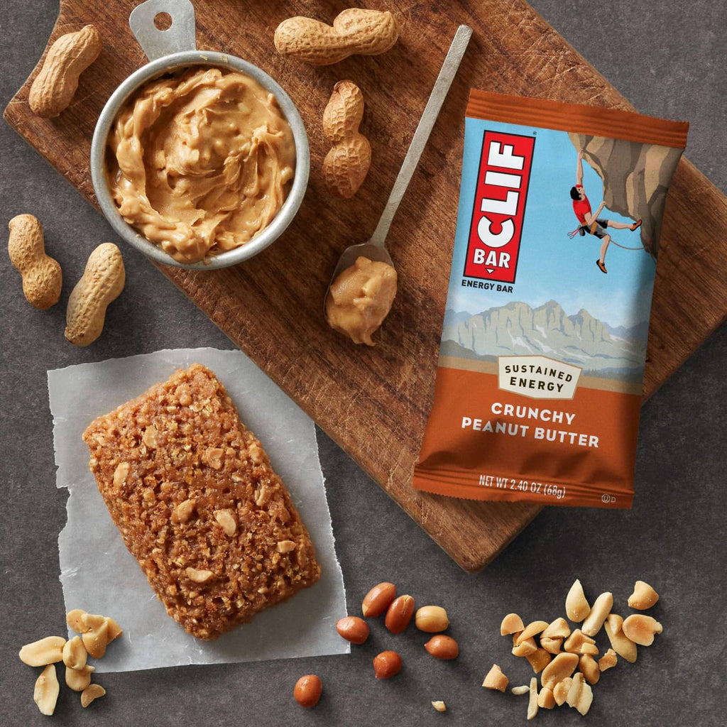 CLIF crunchy peanut butter energy bar with peanuts and peanut butter jar