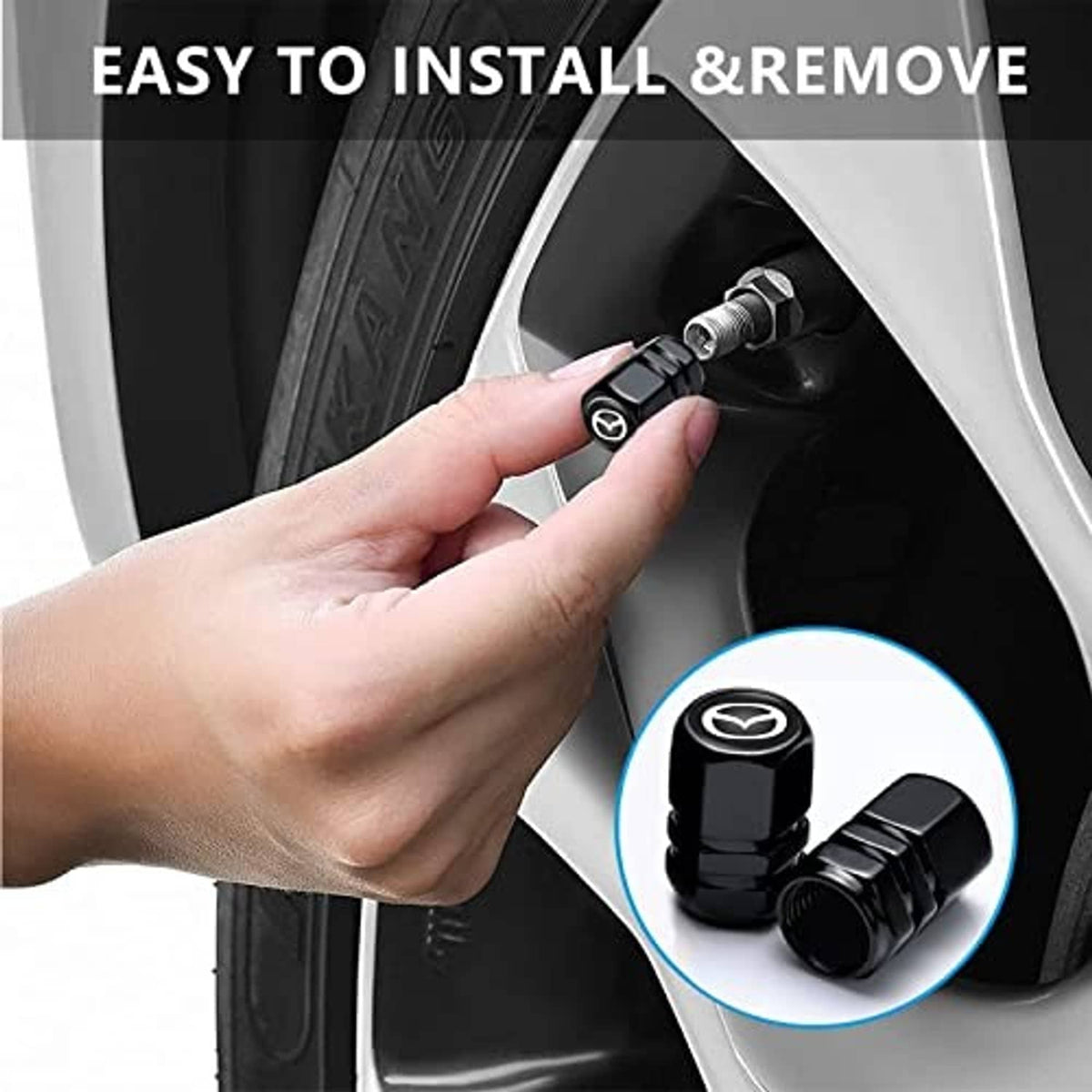 Black metal tire valve stem caps with Mazda logo being installed on car wheel valve