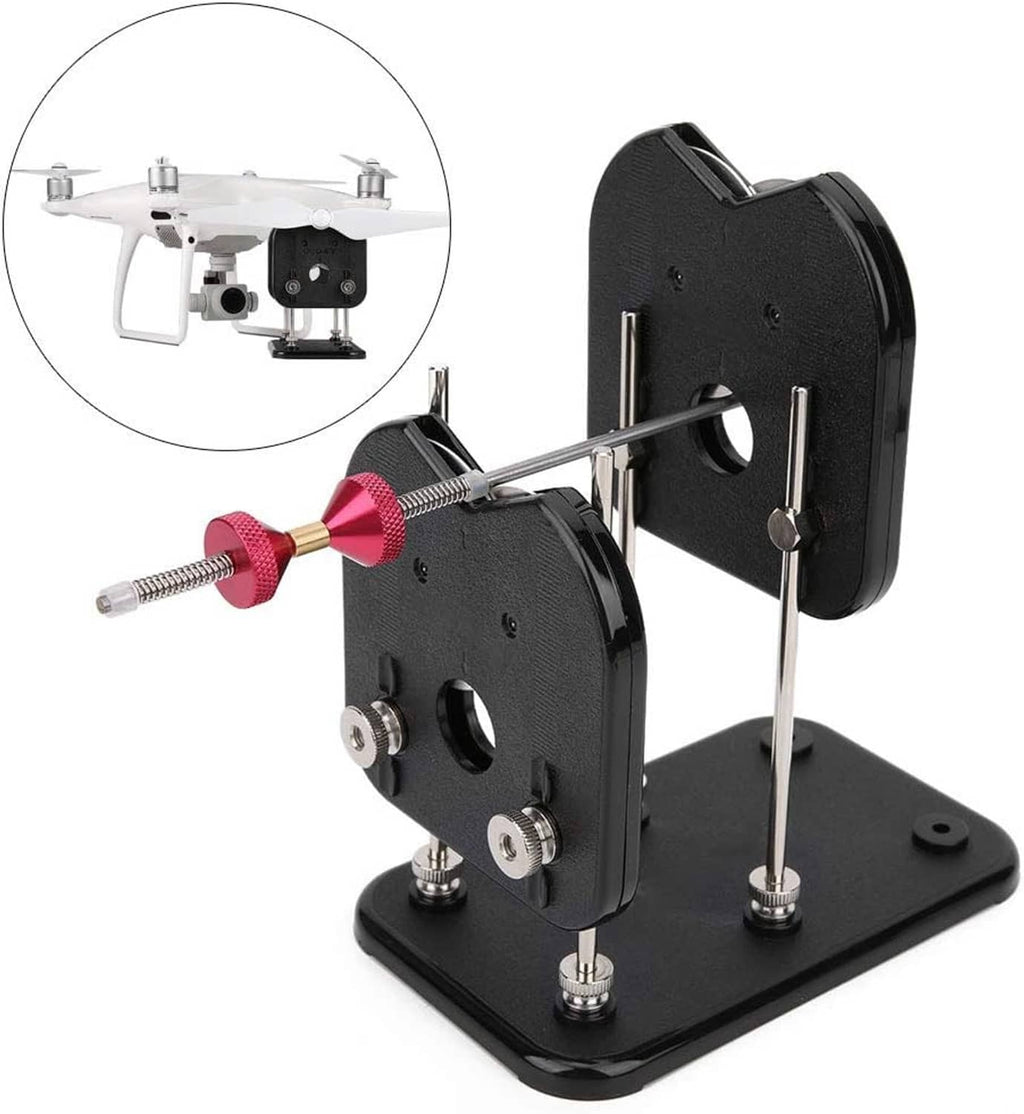RC prop balancer stand angled view with black plates, pink hub, and balancing rods