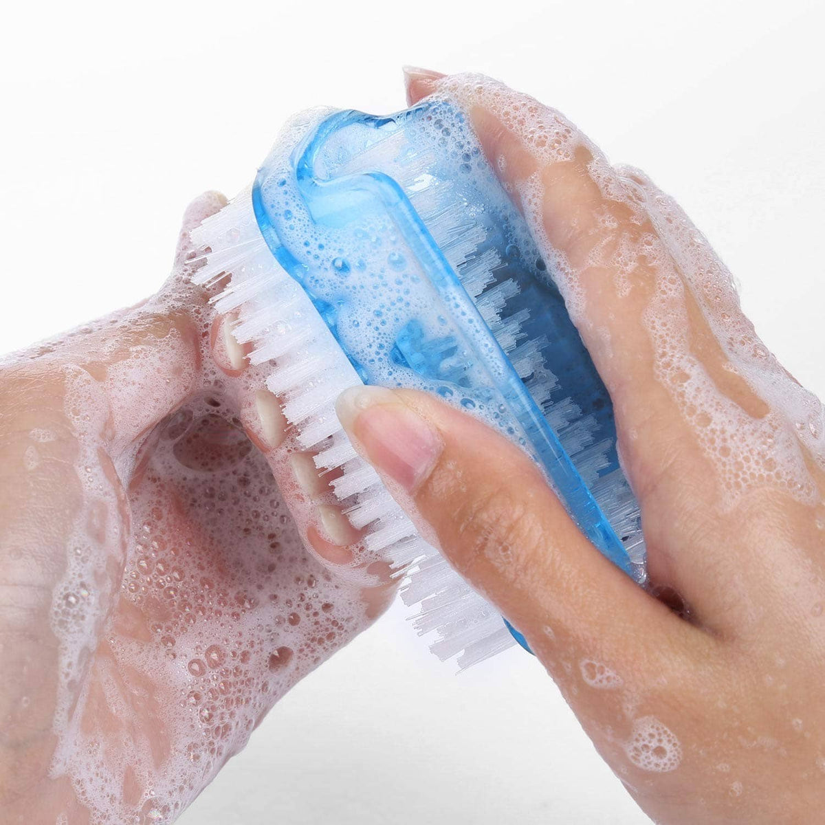 Dual-sided nail scrub brush cleaning fingertips with blue-and-white bristle head