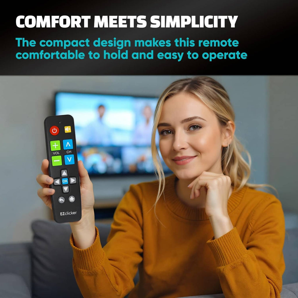 Compact black universal TV remote with large colored buttons held beside TV screen