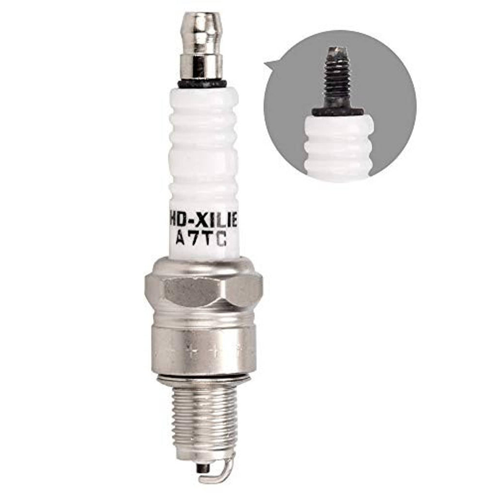 Spark plug with white ceramic insulator and silver metal shell